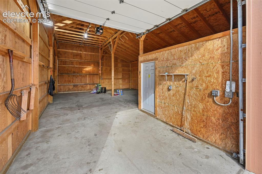 Image 37 of 50: Barn with hay storage and heated tack room