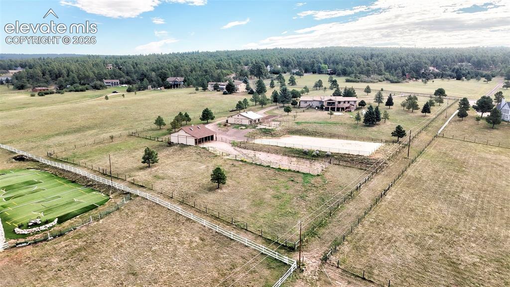 Image 4 of 50: 5 Acre property featuring a main residence, 2 Barns, fenced paddocks, ridin