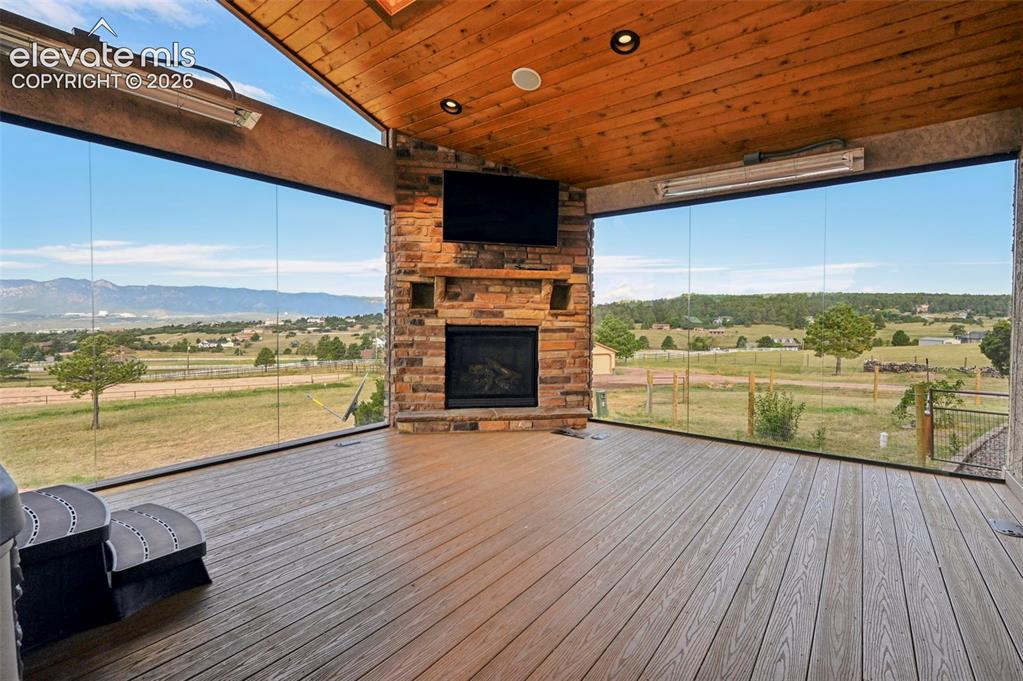 Image 5 of 50: Glassed in Sunroom with panoramic views