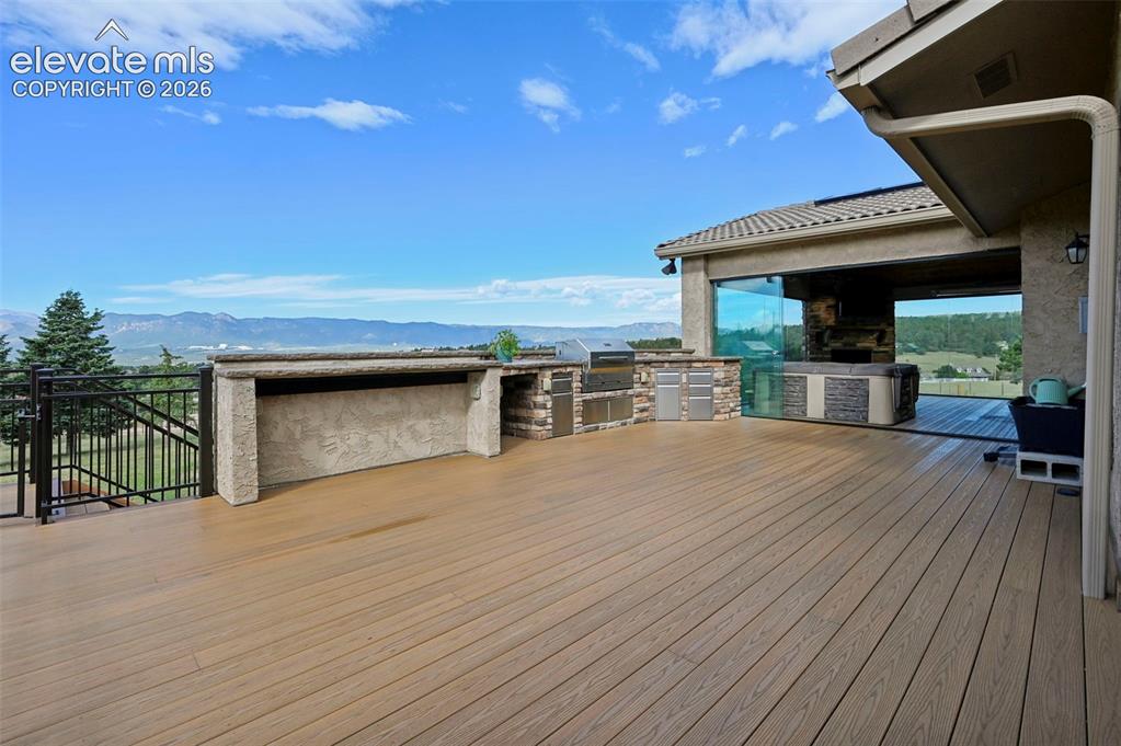Image 9 of 50: Outdoor Built in Bar-B-Que Cook area, trex decking  - Sliding Glass Doors