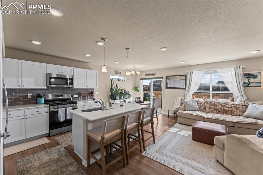Image 2 of 37: The open concept kitchen and living area offer a bright, connected space wi