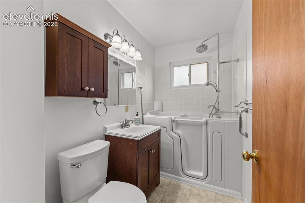 Image 12 of 28: Main level full bath
