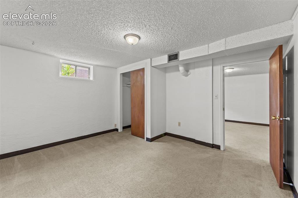 Image 15 of 28: Basement bedroom