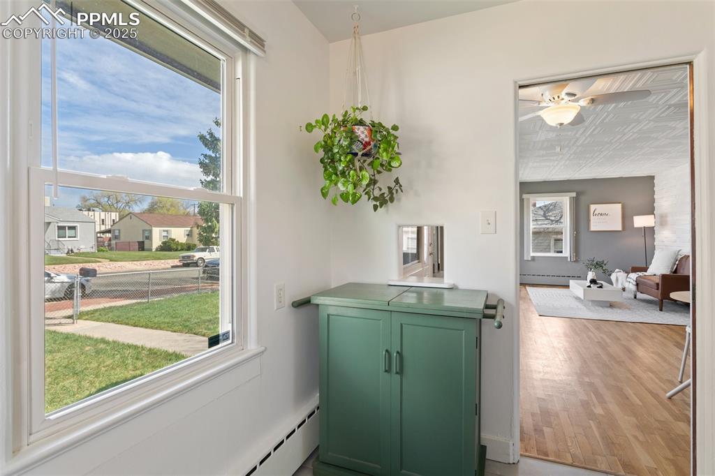 Image 19 of 37: Entryway featuring a baseboard heating unit, an ornate ceiling, a ceiling f