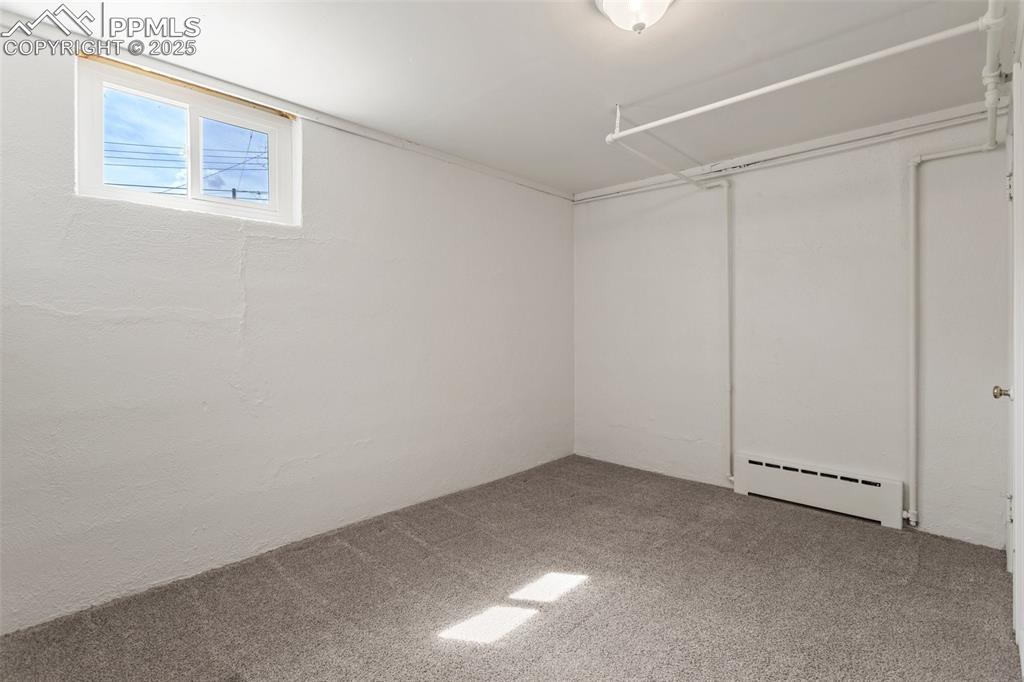 Image 27 of 37: Basement bedroom