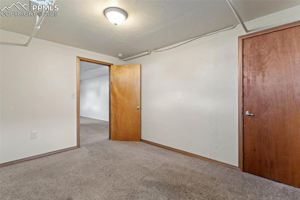 Image 31 of 37: Basement bedroom