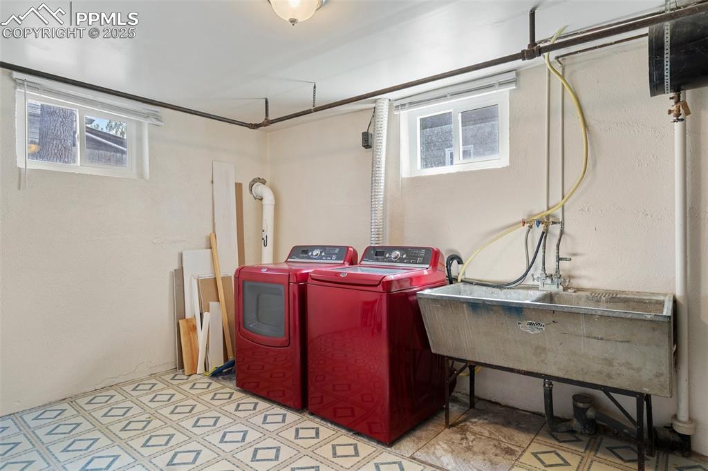 Image 32 of 37: Basement washroom featuring separate washer and dryer, a healthy amount of