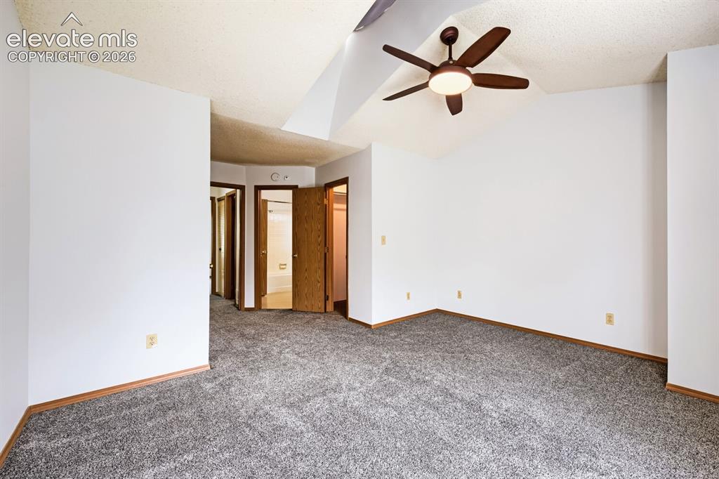 Image 14 of 23: Vaulted ceiling featuring a ceiling fan with integrated lighting