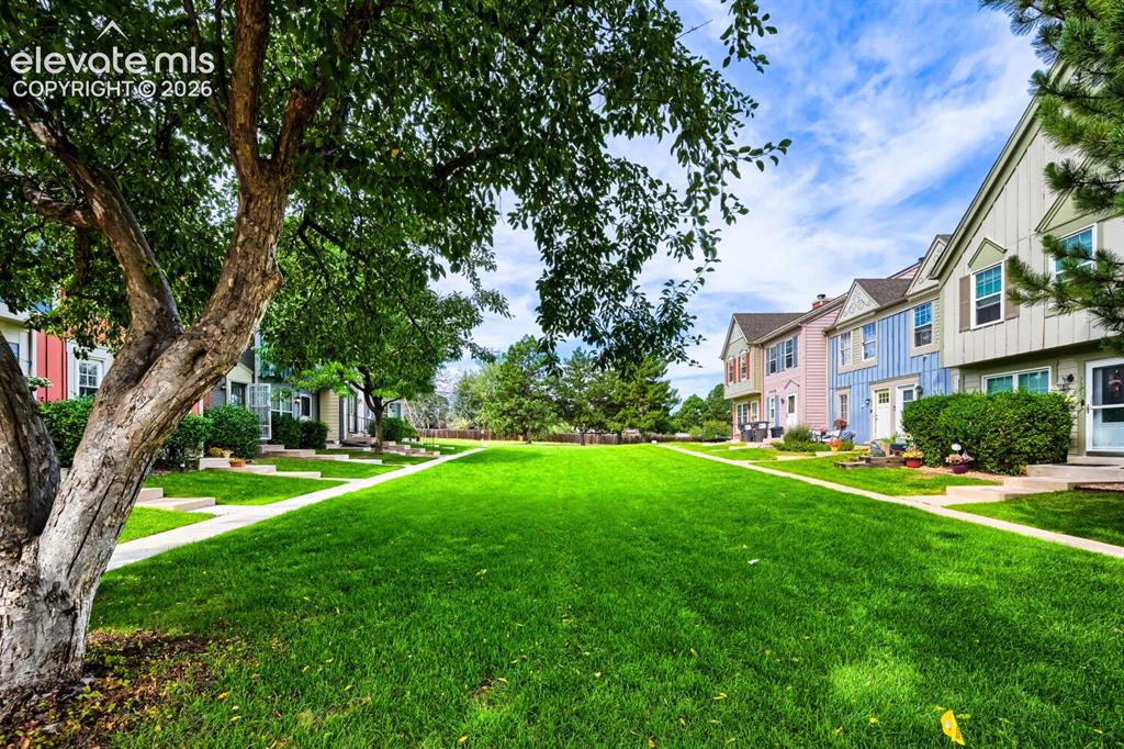 Image 23 of 23: This home is in a very quiet section and is surrounded by lush green areas 