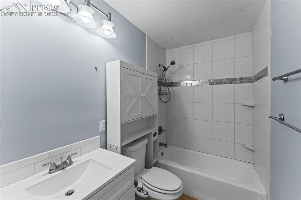 Image 11 of 36: Full bathroom featuring  shower combination and vanity
