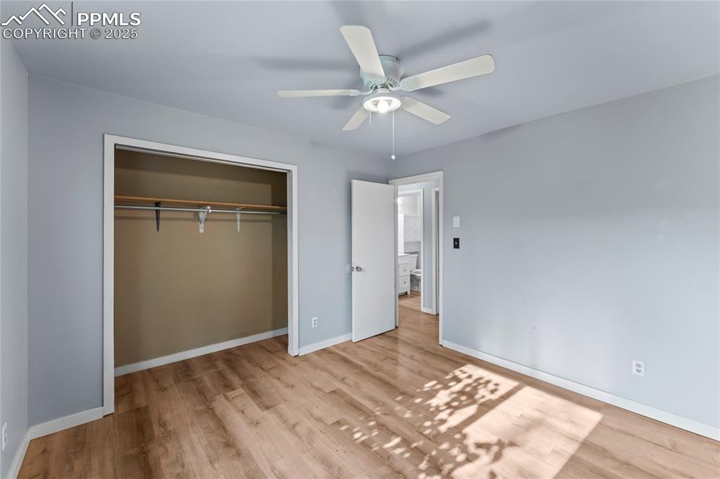 Image 13 of 36: Unfurnished bedroom featuring wood finished floors, a closet, and ceiling f