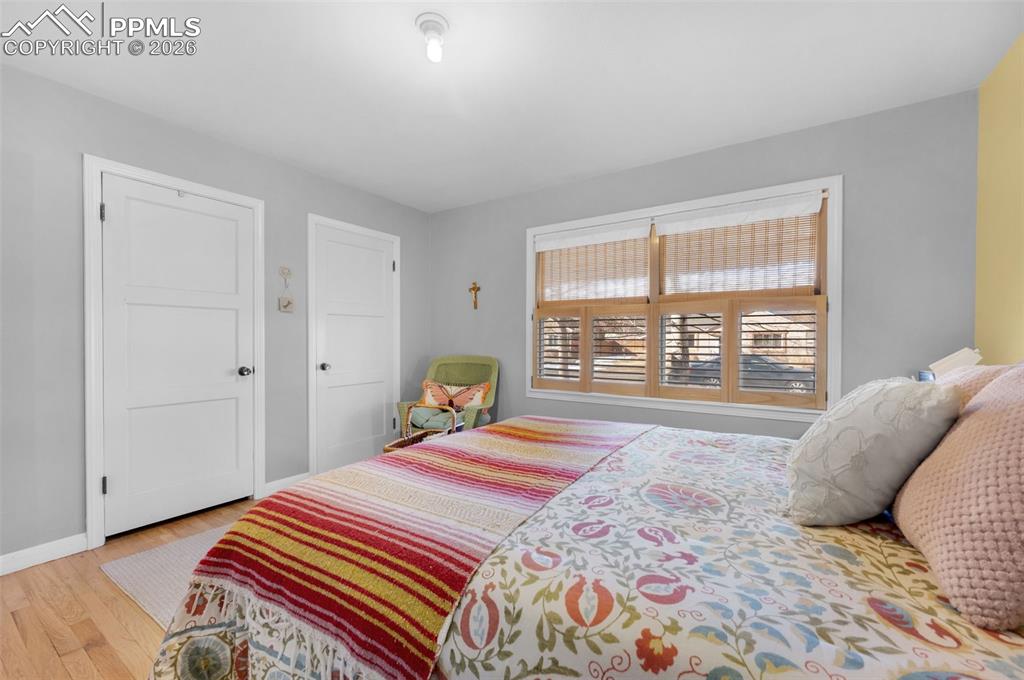 Image 18 of 28: Bedroom with his and her closets