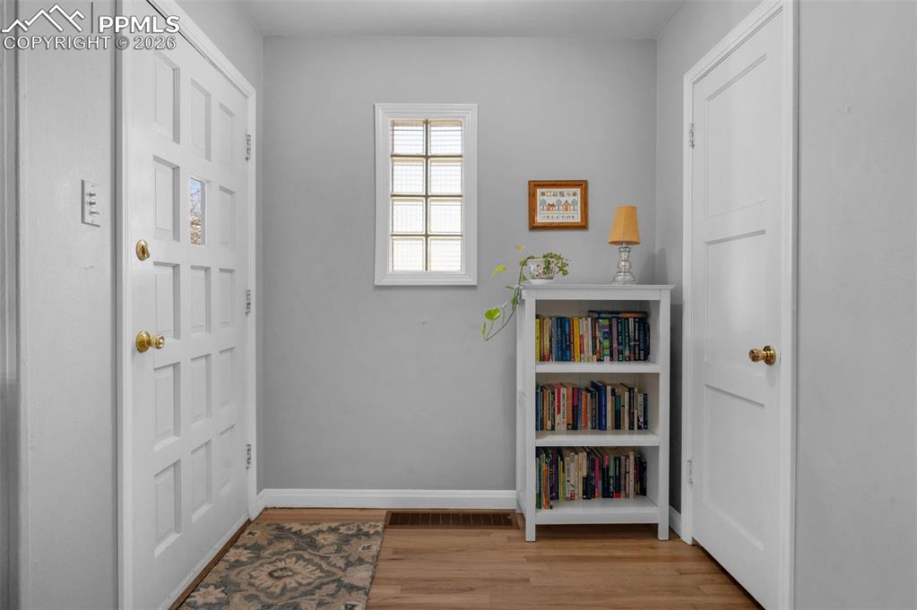 Image 4 of 28: Entry is accented with a qlass brick wall design for natural light