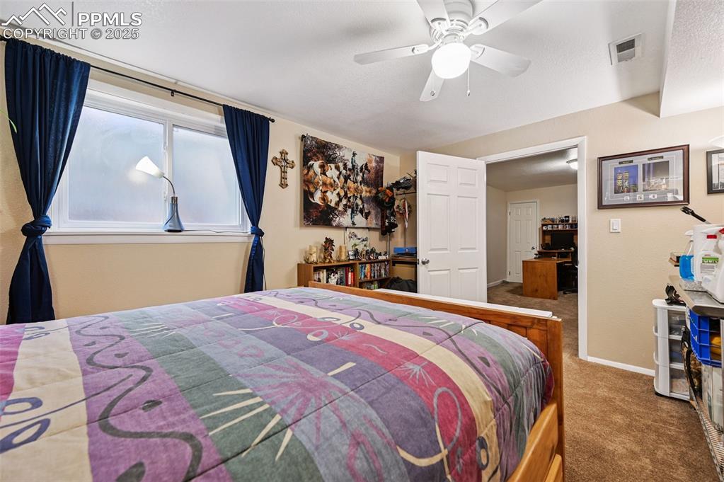 Image 14 of 43: Bedroom featuring carpet floors and ceiling fan