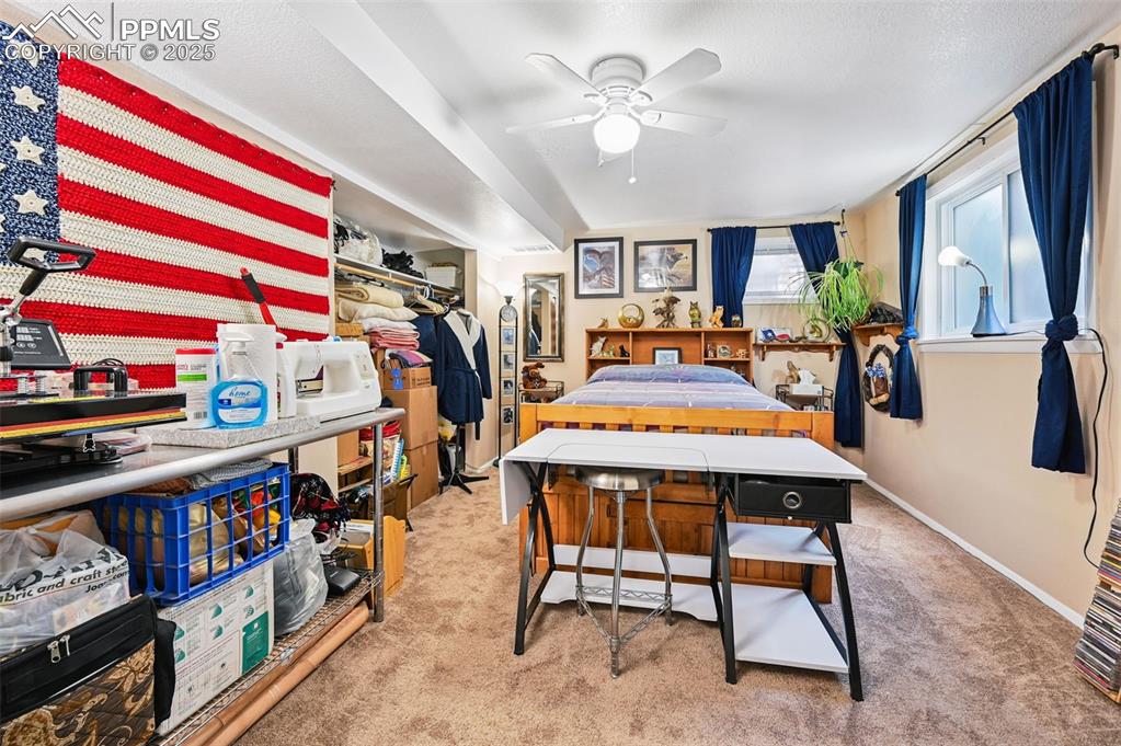 Image 15 of 43: Bedroom with light carpet and ceiling fan