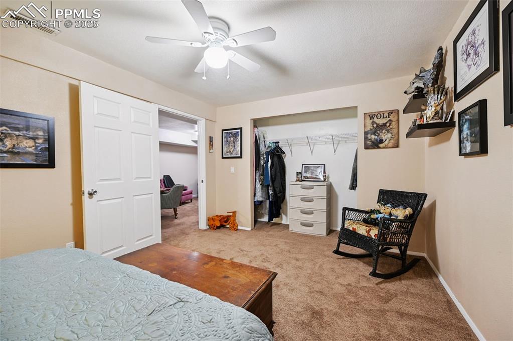 Image 18 of 43: Bedroom featuring light colored carpet, a closet, and ceiling fan