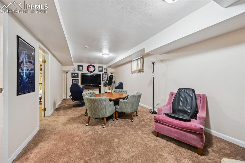 Image 20 of 43: Dining area with carpet and baseboards