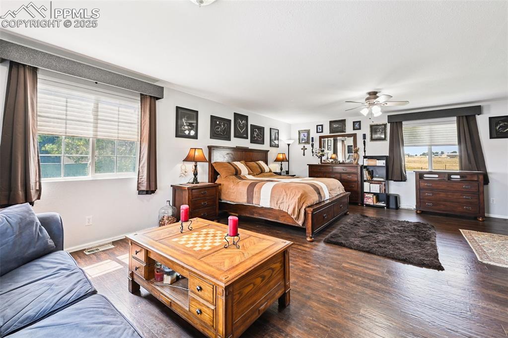 Image 22 of 43: Bedroom featuring hardwood / wood-style floors and a ceiling fan