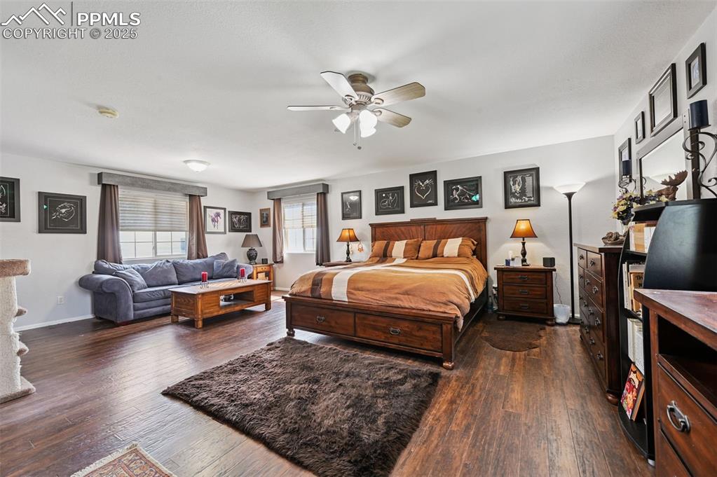 Image 23 of 43: Bedroom with dark wood-type flooring and a ceiling fan
