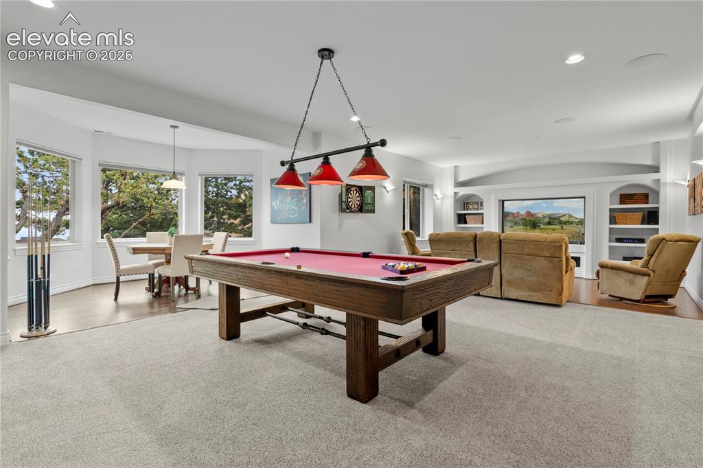 Image 29 of 47: huge entertaining space with poker table, billiards, ping pong and media/ga