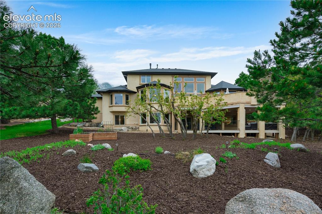 Image 4 of 47: Beautiful landscaping with mature trees.  rrigated above ground gardening b