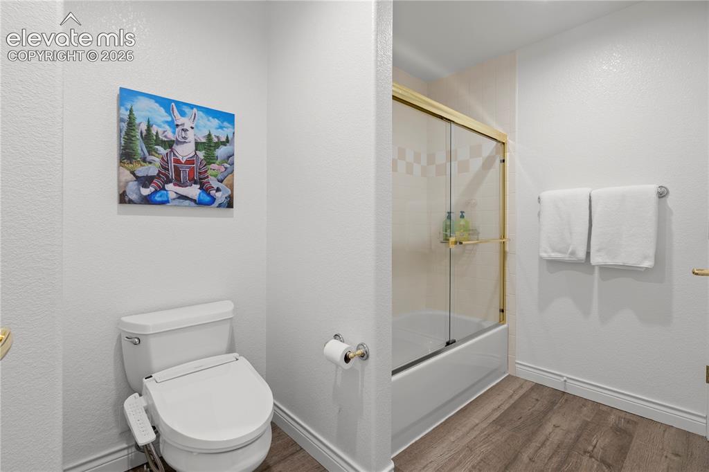 Image 41 of 47: jack and Jill bidet toilet and shower