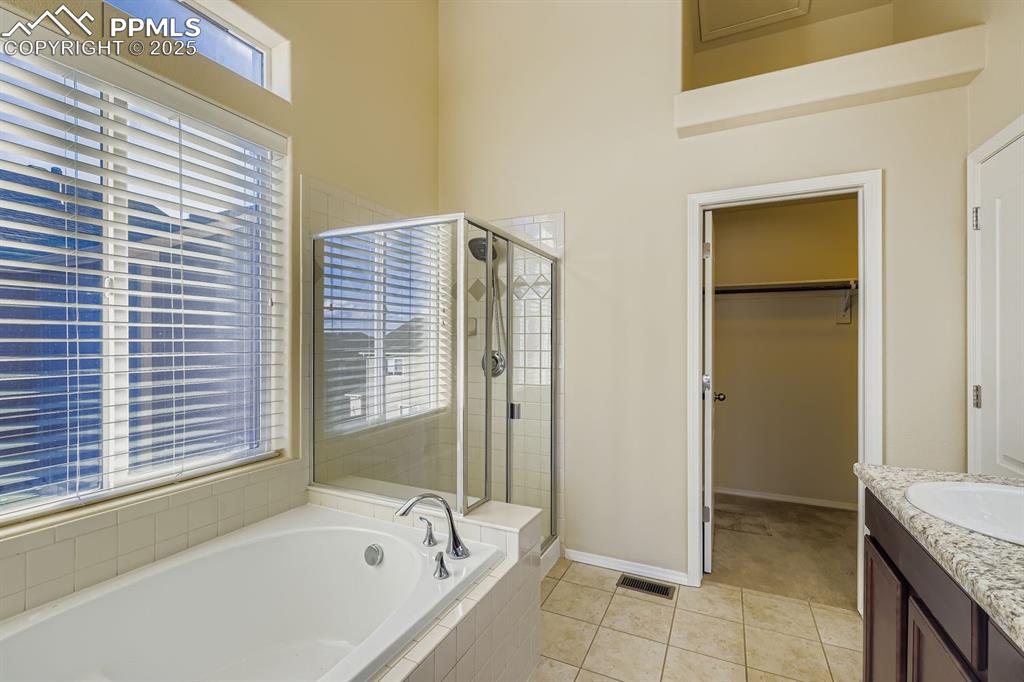 Image 12 of 31: Luxury bath, soaking tub, walk in shower, dual sinks 