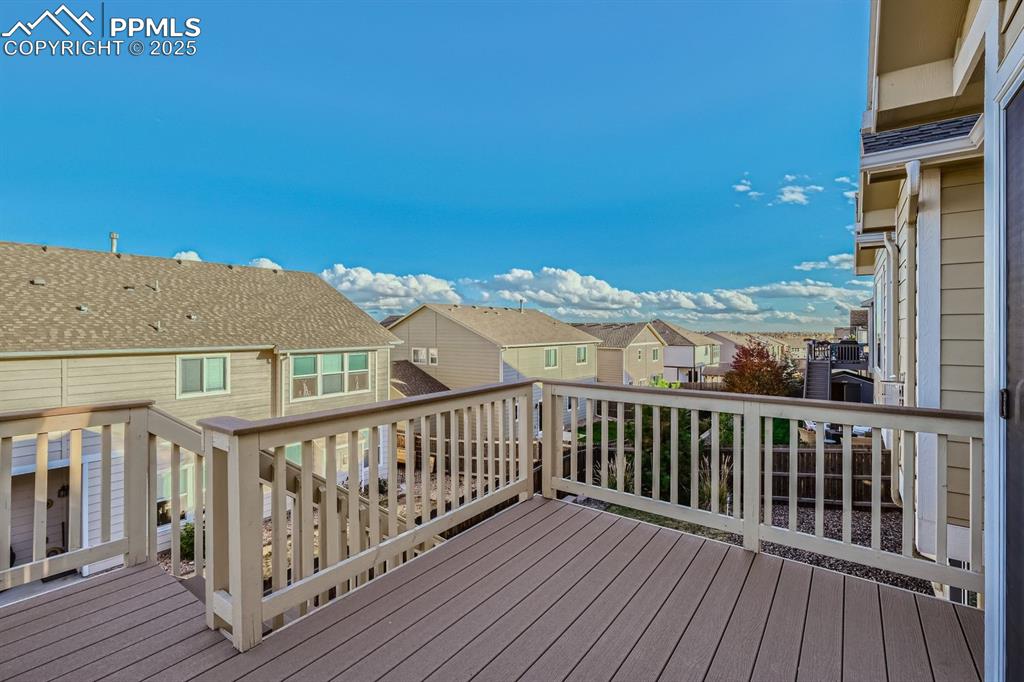 Image 25 of 31: Wooden terrace with a residential view