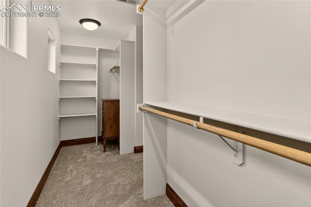 Image 25 of 41: Dual walk-in closets within primary suite