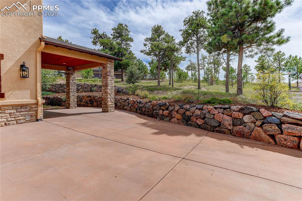 Image 36 of 41: Patio extends for impressive outdoor space