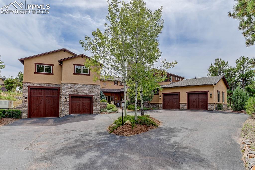 Image 39 of 41: 3 car + RV garage with dropped roofline