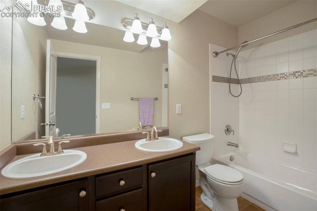 Image 21 of 33: Basement Bathroom with Dual Vanities!