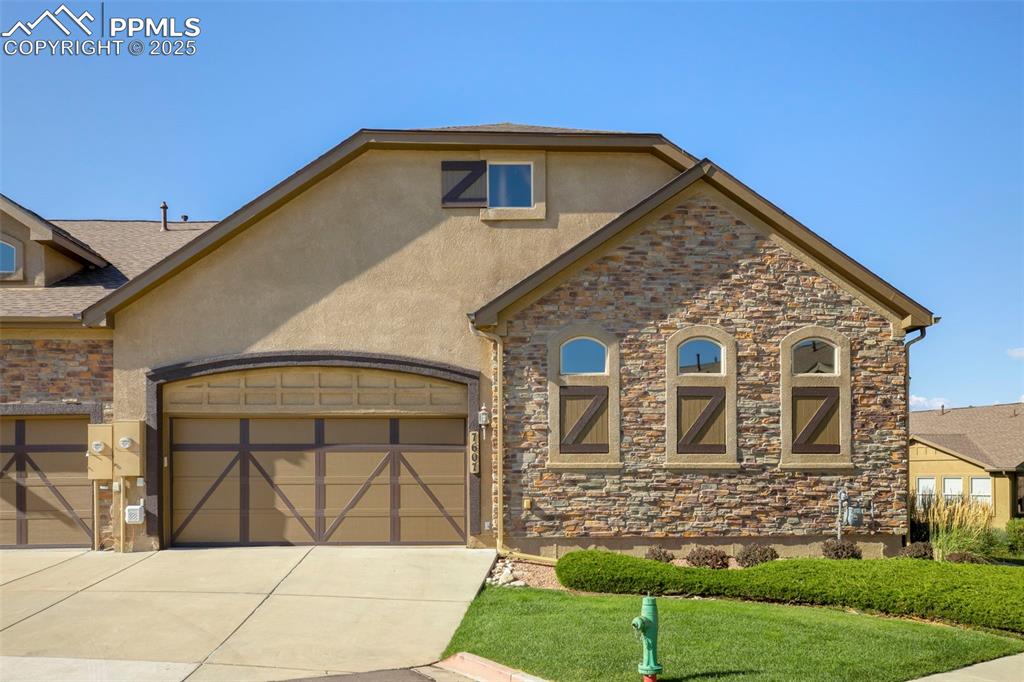 Image 24 of 33: 2 Car Garage w/Tons of Storage to Include Apparatus for Hanging Your Bicycl