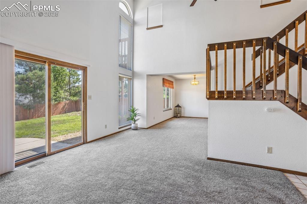 Image 11 of 29: LR with slider entry door to rear yard/patio.