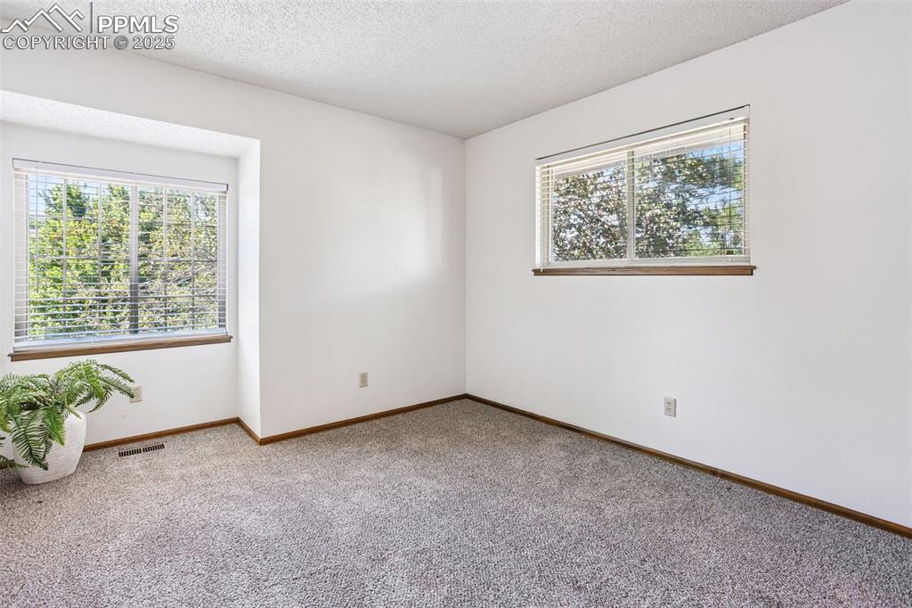 Image 16 of 29: upstairs bedroom with walk in closet