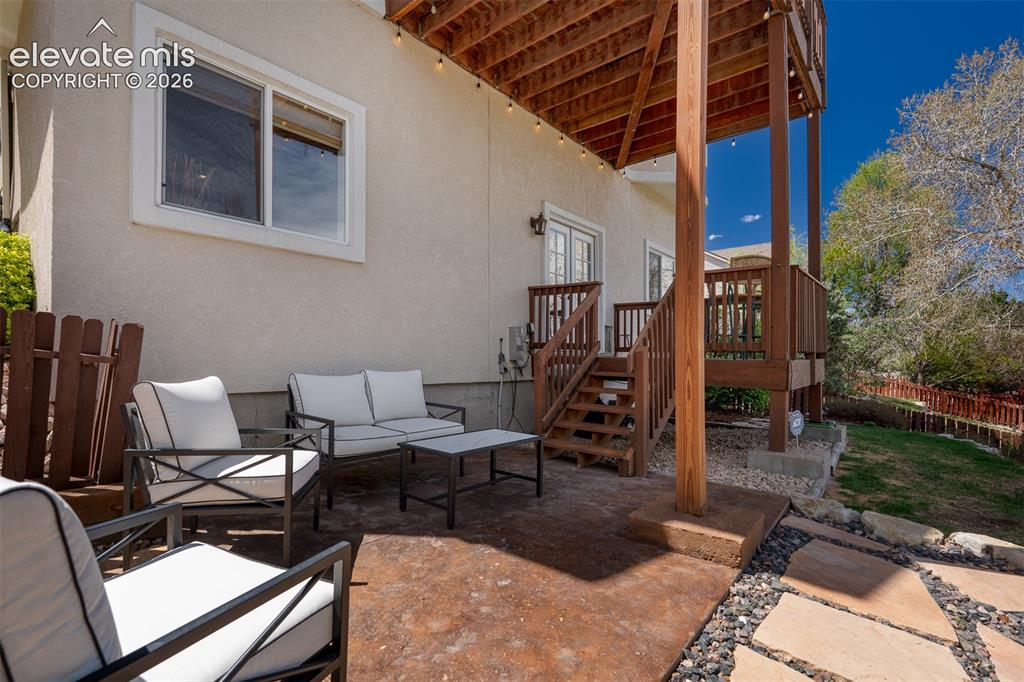 Image 44 of 50: Enjoy summer evenings on the back yard patio overlooking the park.