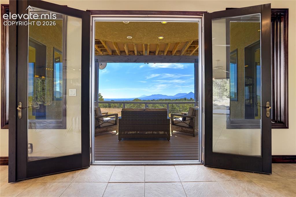 Image 17 of 50: Covered Deck - with walkouts from dining and main level bedroom