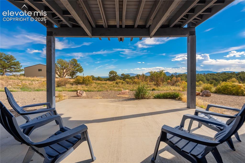 Image 33 of 50: Off Rec Room and 2 Basement Bedrooms walk out to this covered patio
