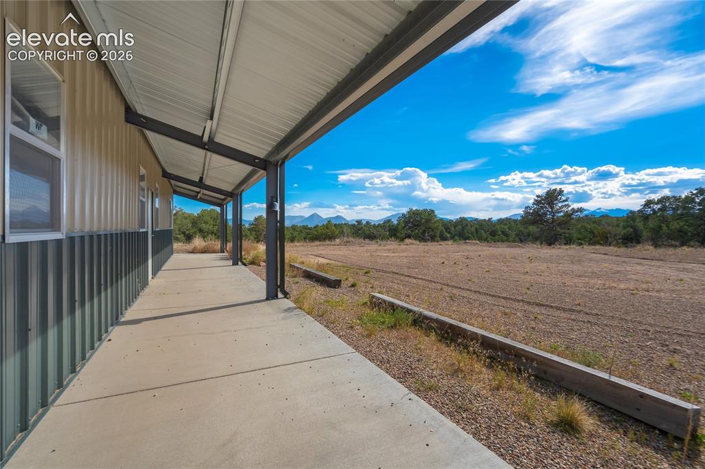 Image 47 of 50: Plenty of level space for entertaining, etc right off the outbuilding