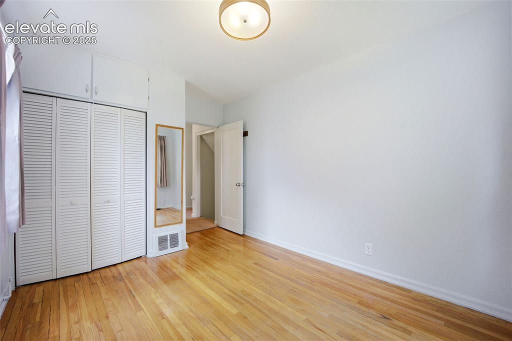 Image 21 of 46: Hardwood flooring throughout, louvered bi-fold closet doors, integrated upp