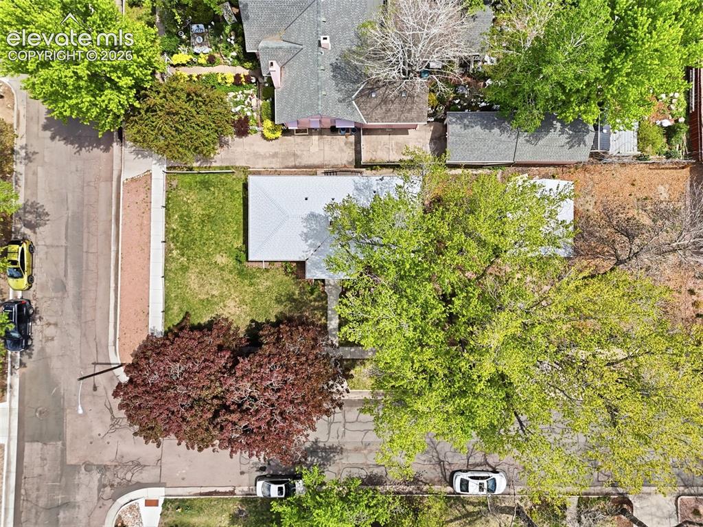 Image 41 of 46: Aerial view of a residential property featuring a gray shingled roof, a rec