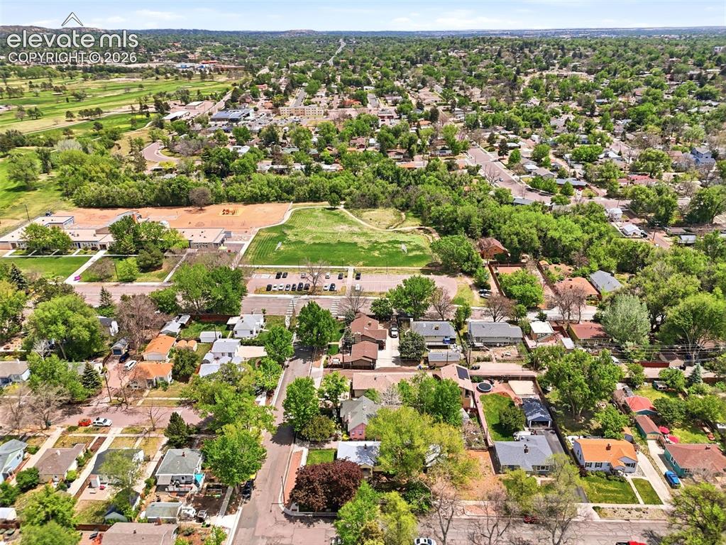 Image 42 of 46: Aerial overview of a residential area featuring single-story and two-story 
