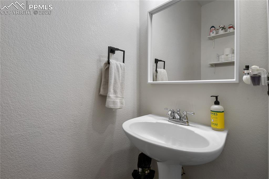 Image 17 of 31: Main level half bath