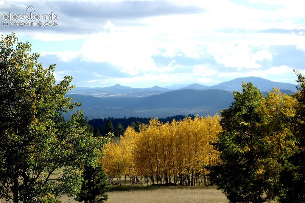 Image 6 of 40: Rolling hills and distant mountains complement the expansive natural landsc