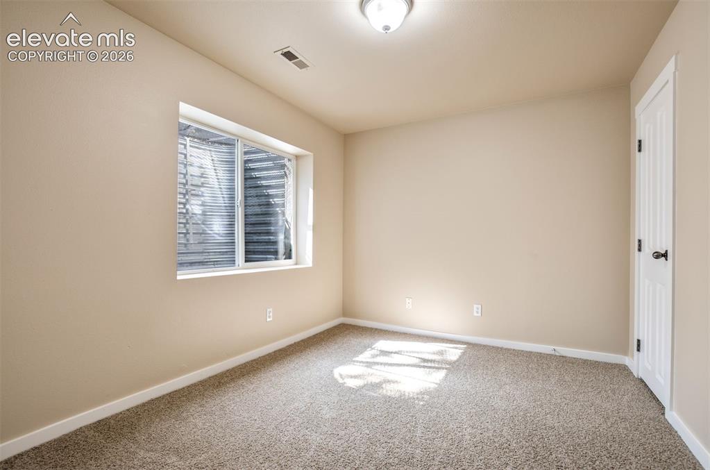 Image 25 of 34: Basement 3rd bedroom with walk in closet