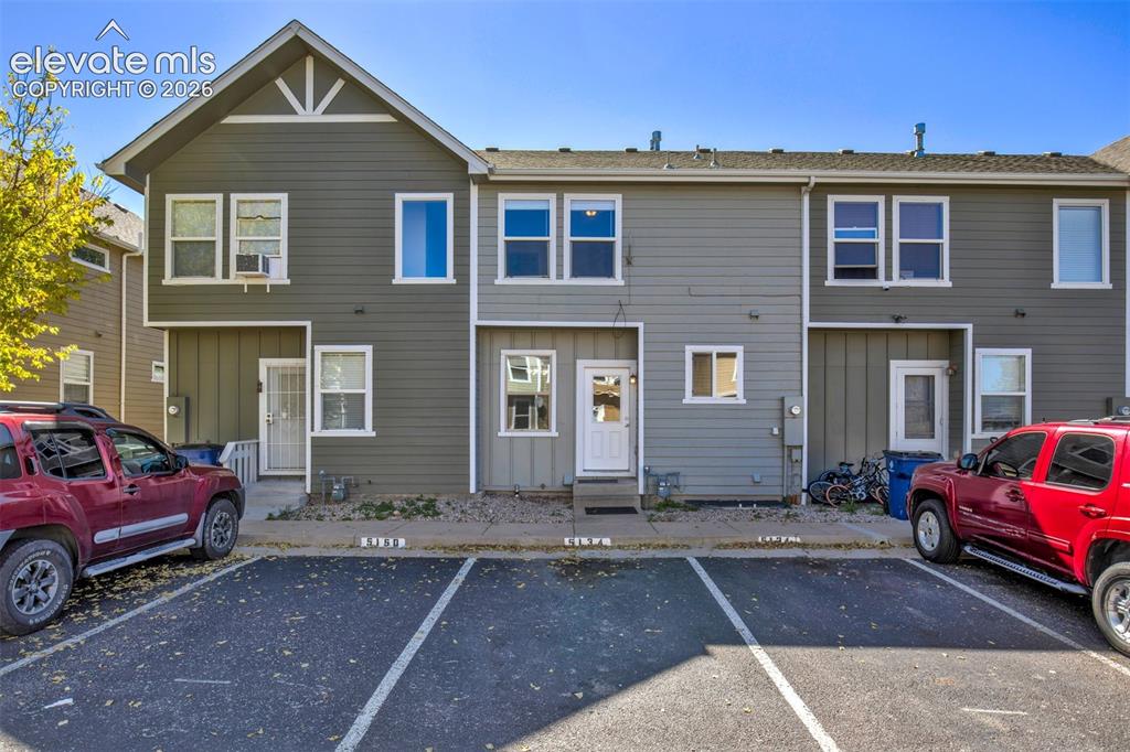 Image 6 of 34: Assigned parking at back of home