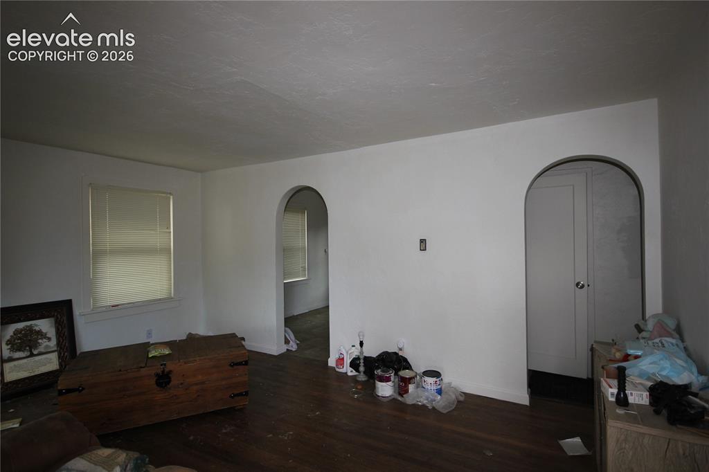Image 10 of 26: Wood floors in living room