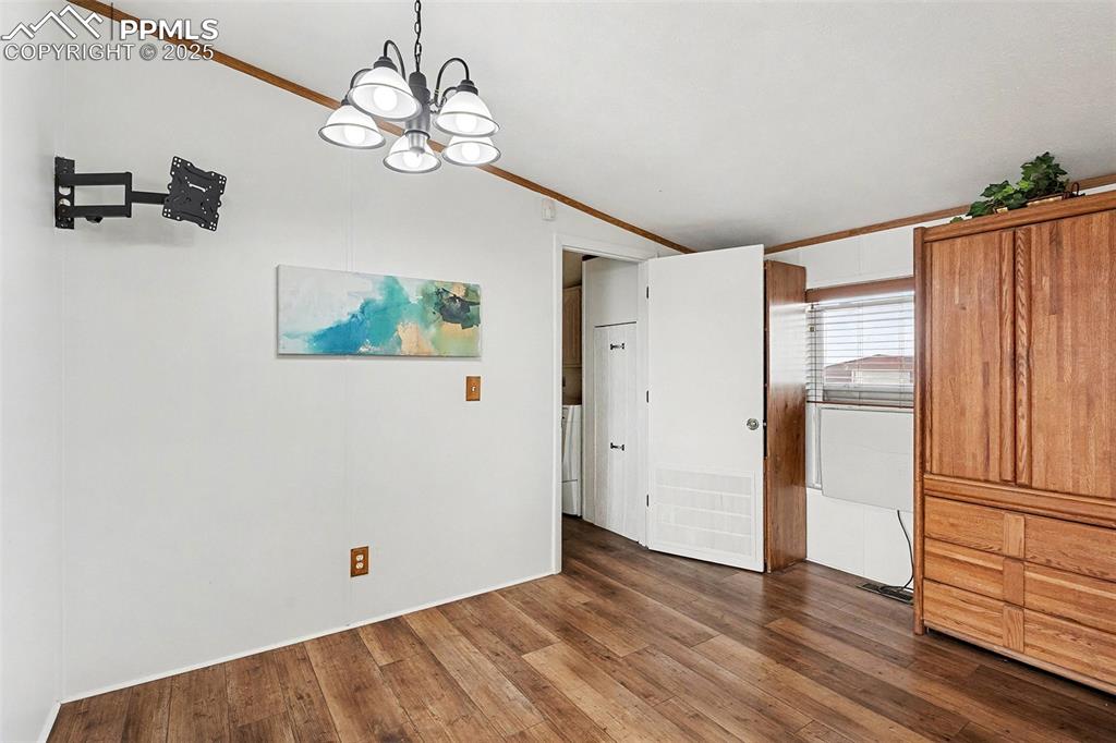 Image 5 of 15: Dining area and extra cabinets and shelves for storage