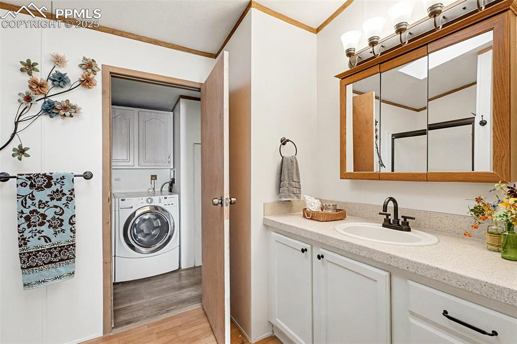 Image 8 of 15: Adjoining master bathroom with new plumbing fixtures, new toilet, new showe