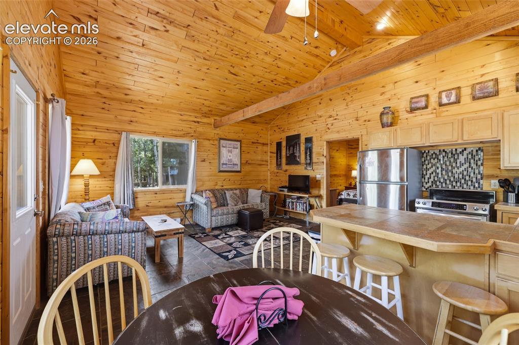 Image 18 of 28: Natural wood plank walls and vaulted wood plank ceilings